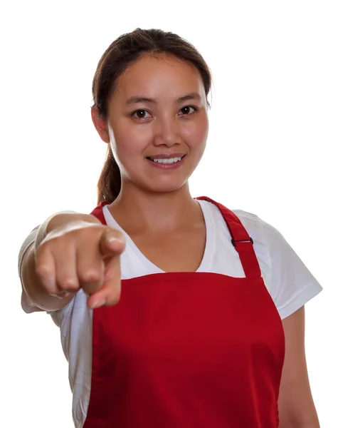 Friendly chinese waitress pointing at camera — Stock Photo, Image