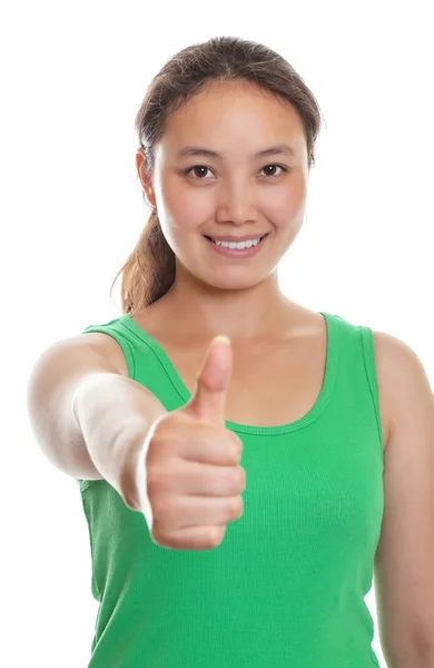 Sporty japanese girl shows her thumb — Stock Photo, Image