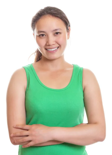 Smiling asian girl with crossed arms — Stock Photo, Image