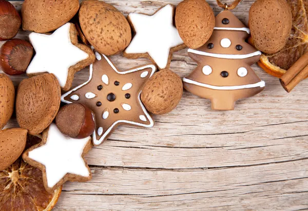 Three cinnamon stars with other christmas decoration — Stock Photo, Image