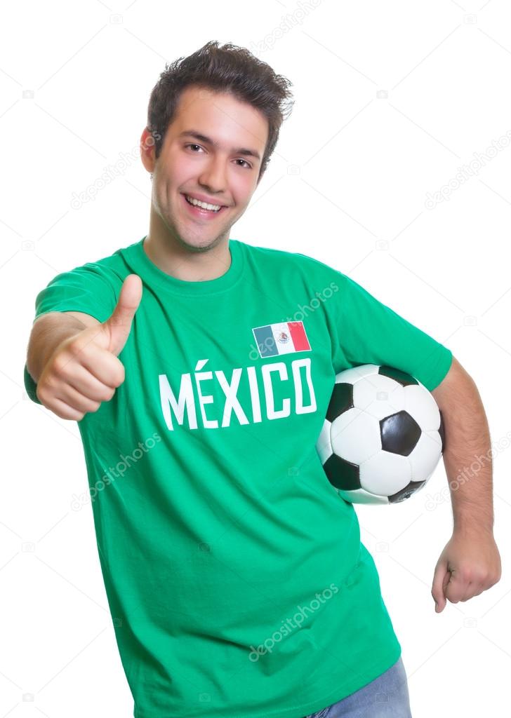 Laughing mexican soccer fan with ball showing thumb