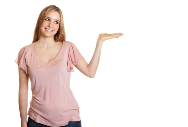 Woman with long blond hair presents something — Stock Photo, Image