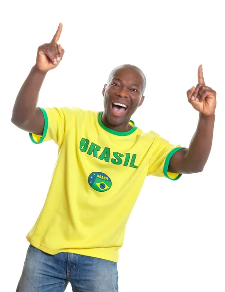 Brazilian soccer fan cheering and pointing — Stock Photo, Image