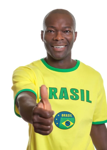 Brazilian football fan showing thumb — Stock Photo, Image