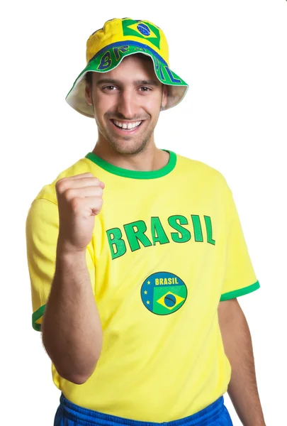 Attraente ragazzo con maglia brasiliana ridere e cappello — Foto Stock