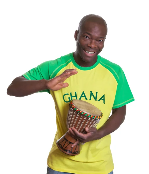 Sports fan from Ghana playing drums — Stock Photo, Image