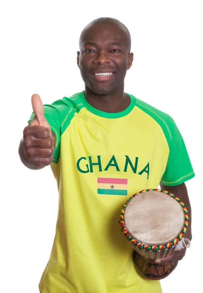 Abanico deportivo de Ghana con tambor mostrando pulgar — Foto de Stock