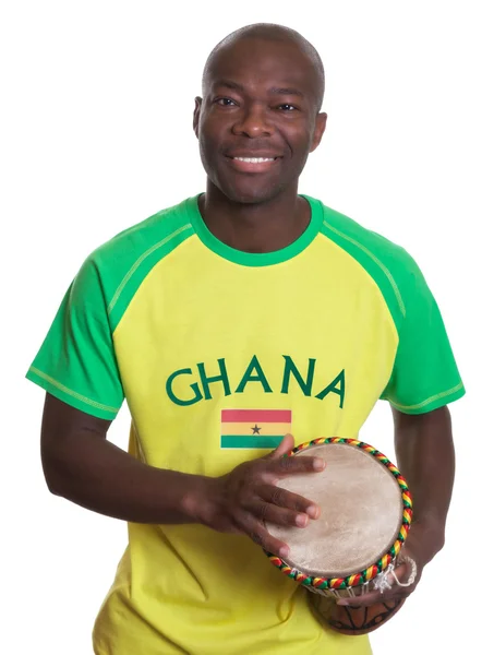 Laughing sports fan from Ghana with drums — Stock Photo, Image