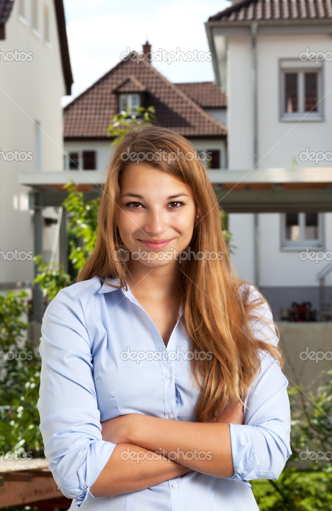 Young woman standing in front of a building