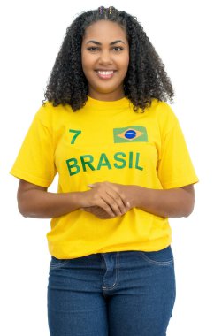 Laughing brazilian female soccer fan isolated on white background for cut out
