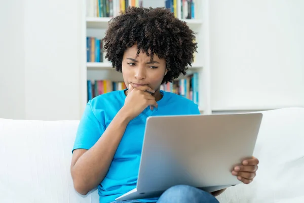 African American Young Adult Woman Reading News Online Computer Indoors —  Fotos de Stock
