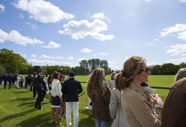 Berkshire, United Kingdom: May 11, 2014 Guests attended for De Beers Diamond Jewellers Royal Charity Polo Cup Royalty Free Stock Photos