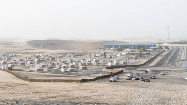 qatar adventurous place khor al udeid ,sea line area filled with many tents.. dunes stay cation