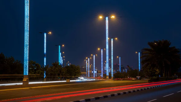 Doha,Qatar- September 09,2022 : Qatar airport highway during night with light trails.
