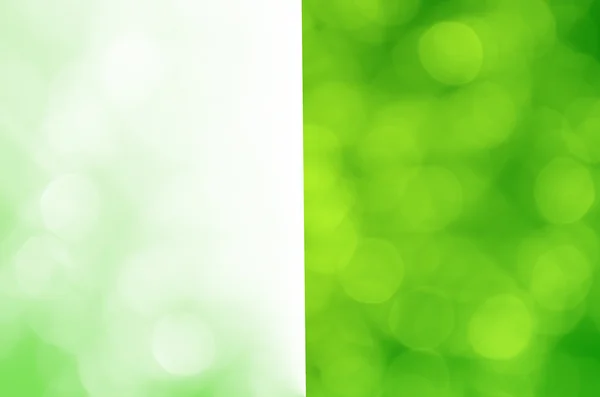 Helles Bokeh auf grünem Hintergrund — Stockfoto