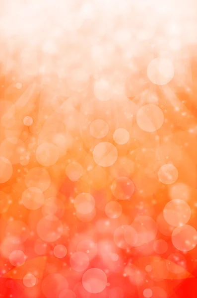 Abstraktes Licht-Bokeh auf orangefarbenem Hintergrund. lizenzfreie Stockfotos