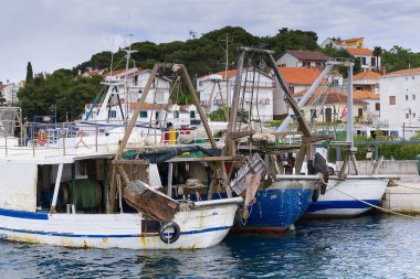 Old Fishing boats parking on harbor, Croatia