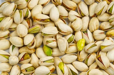 Fıstık deseni ve arka plan. Arka plan olarak lezzetli şam fıstıkları, kopyalama alanı