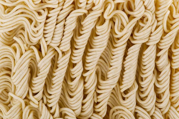 Fideos instantáneos crudos. Cerrar textura de fideos instantáneos para el fondo. —  Fotos de Stock