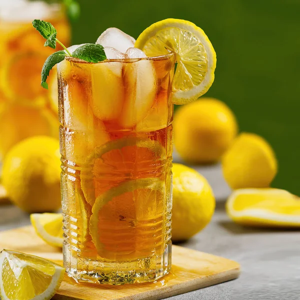 Iced tea. Traditional iced tea with lemon and ice in tall glasses Royalty Free Stock Images
