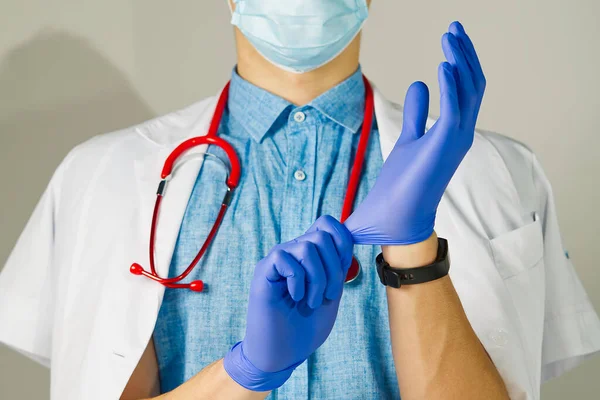 Unrecognizable young man doctor standing over light background — Stock Photo, Image