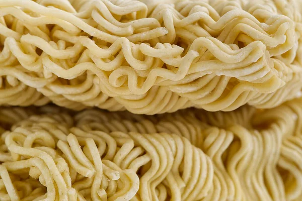 Fideos instantáneos crudos. Cerrar textura de fideos instantáneos para el fondo. —  Fotos de Stock