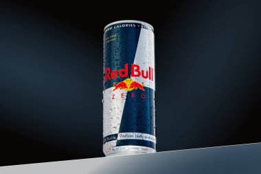 Tallinn, Estonia May, 2022: Aluminium can of Red Bull Energy drink modern Background.Red Bull is the most popular energy drink
