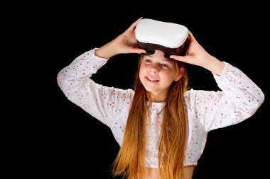Young woman wearing VR glasses and interacting with virtual reality, entertainment, education and innovative technology concept. goggles to interact with metaverse