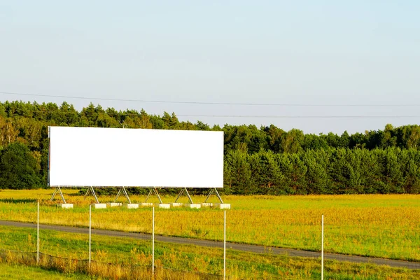 blank advertising billboard mockup. template for design. advertising billboard at sunset. large advertising road banner.