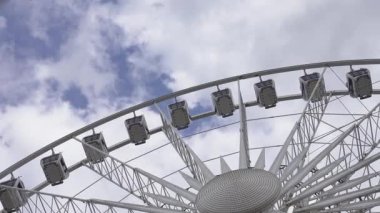 observation wheel against the sky. big wheel against blue sky. Ferris Wheel Against a Blue Sky. Concept entertainment
