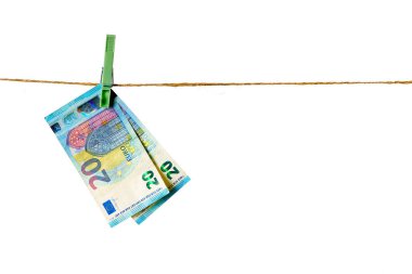 Euro banknotes hanging on a clothesline against white background. Euro money on rope isolated on white background. Money laundering concept