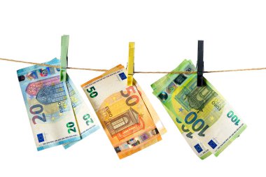 Euro banknotes hanging on a clothesline against white background. Euro money on rope isolated on white background. Money laundering concept