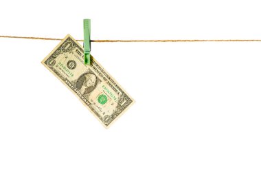 Money laundering. Dollar banknotes hanging on clothesline against white background. USD laundering concept.