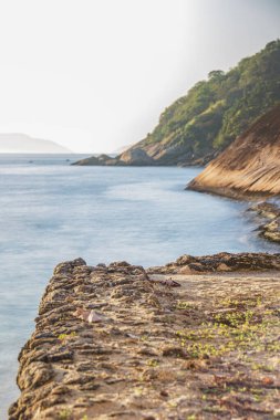 long exposure details of the red beach of Urca in Rio de Janeiro.