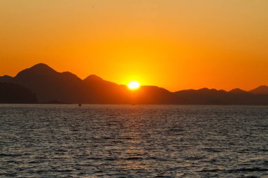 sunrise at Copacabana Beach in Rio de Janeiro.