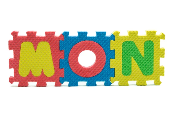 Word MON formed with colorful foam puzzle toy isolated on white — Stock Photo, Image