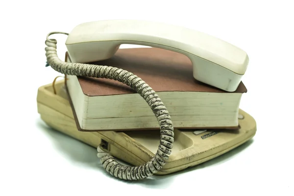 Old Telephone and book cover with dust — Stock Photo, Image