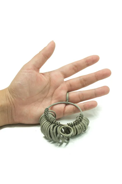 Hand met juwelier vinger sizing tools. ring meter, ring maatregel — Stockfoto