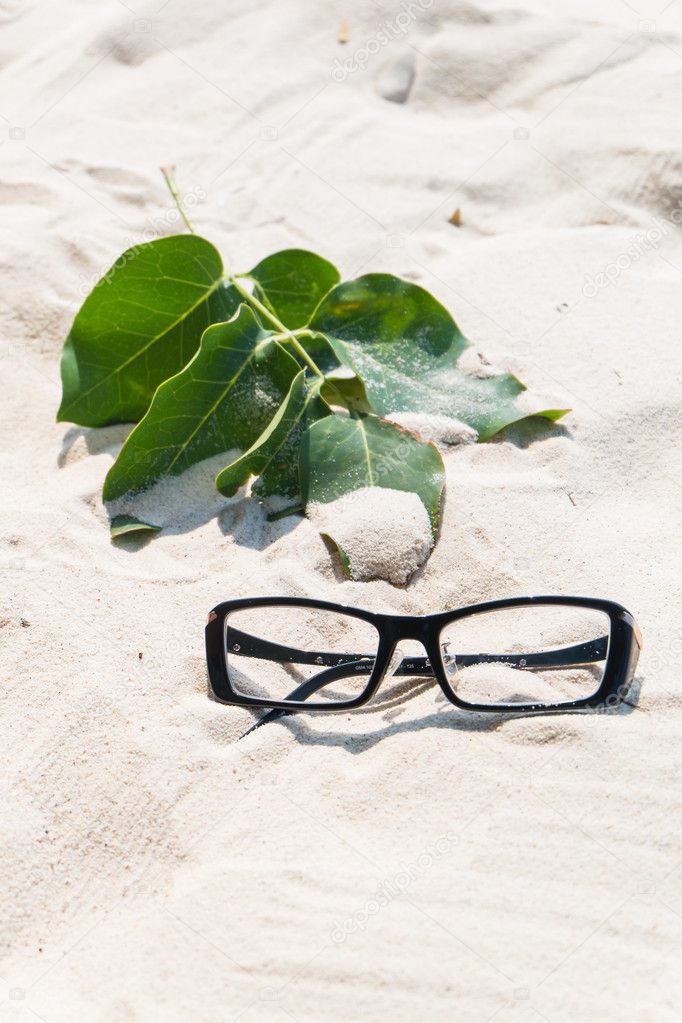 eyeglasses on the sand 