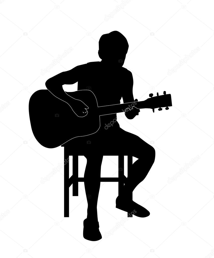 Silhouette of a man playing an acoustic guitar