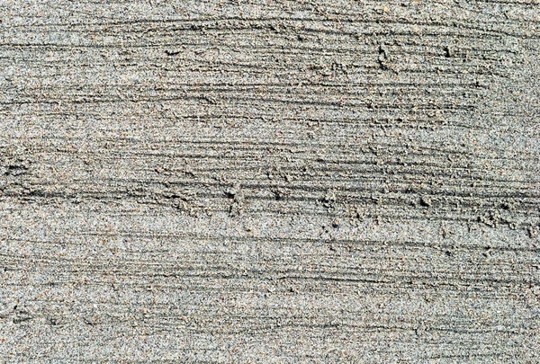 Detail van zand op het strand Stockfoto