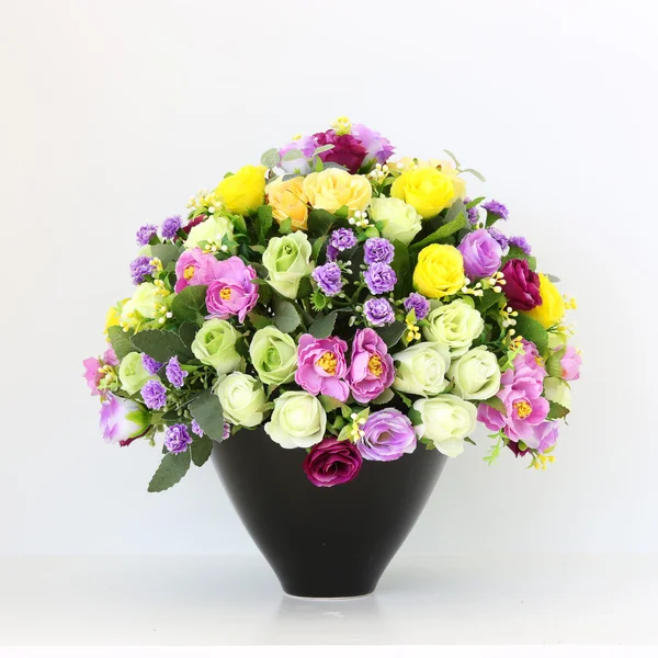 Colorful bunch of flowers in black vase — Stock Photo, Image