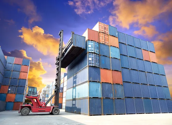 Forklift handling the container box at dockyard with beautiful s — Stock Photo, Image