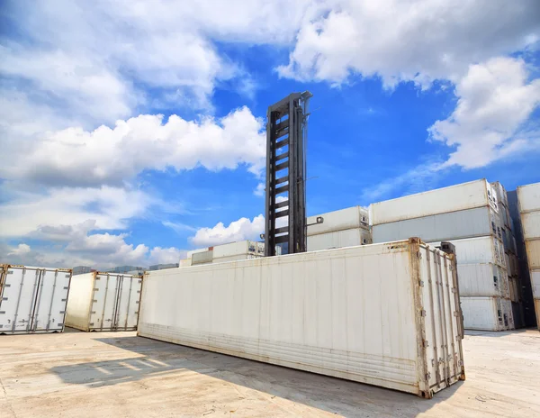 Forklift handling the reefer container box at dockyard — Stock Photo, Image