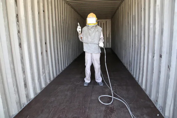 Worker prepare spray painting color inside wall container box st — Stock Photo, Image