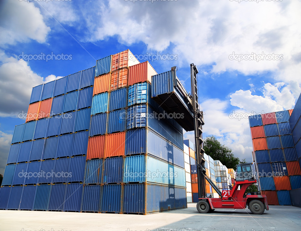forklift handling the container box at dockyard