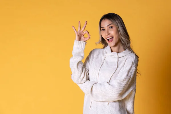 Beautiful Young Woman Yellow Sweater Green Shirt Showing Victory Sign Stock Picture