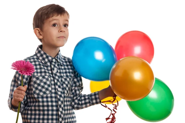 Ragazzo con palloncini e fiore — Foto Stock