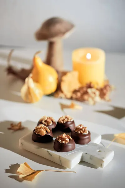 Chocolate Pralines Walnut Nuts Marble Cutting Board Closeup Candy Autumn — Stock Photo, Image