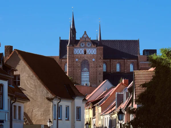 Historical houses and St. George's Church, example of North German Brick Gothic architecture. Mecklenburg-Vorpommern region of Germany.
